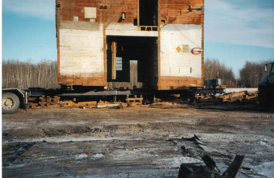 A large grain elevator sits on one of McConnell Building Movers high tech hydraulic dollies