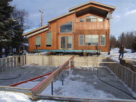 McConnell's staff prepare to move a large, ornate cabin to a new setting.